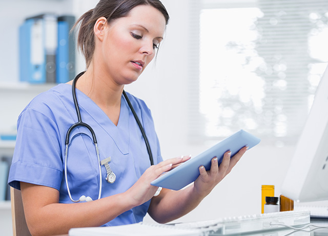 Nurse Looking at Tablet