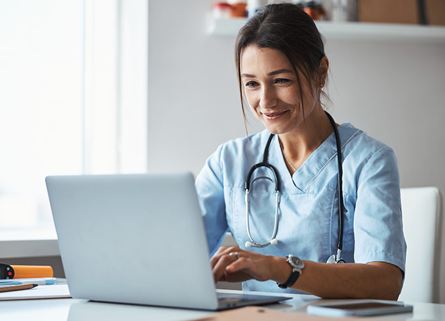 Doctor Looking at Computer